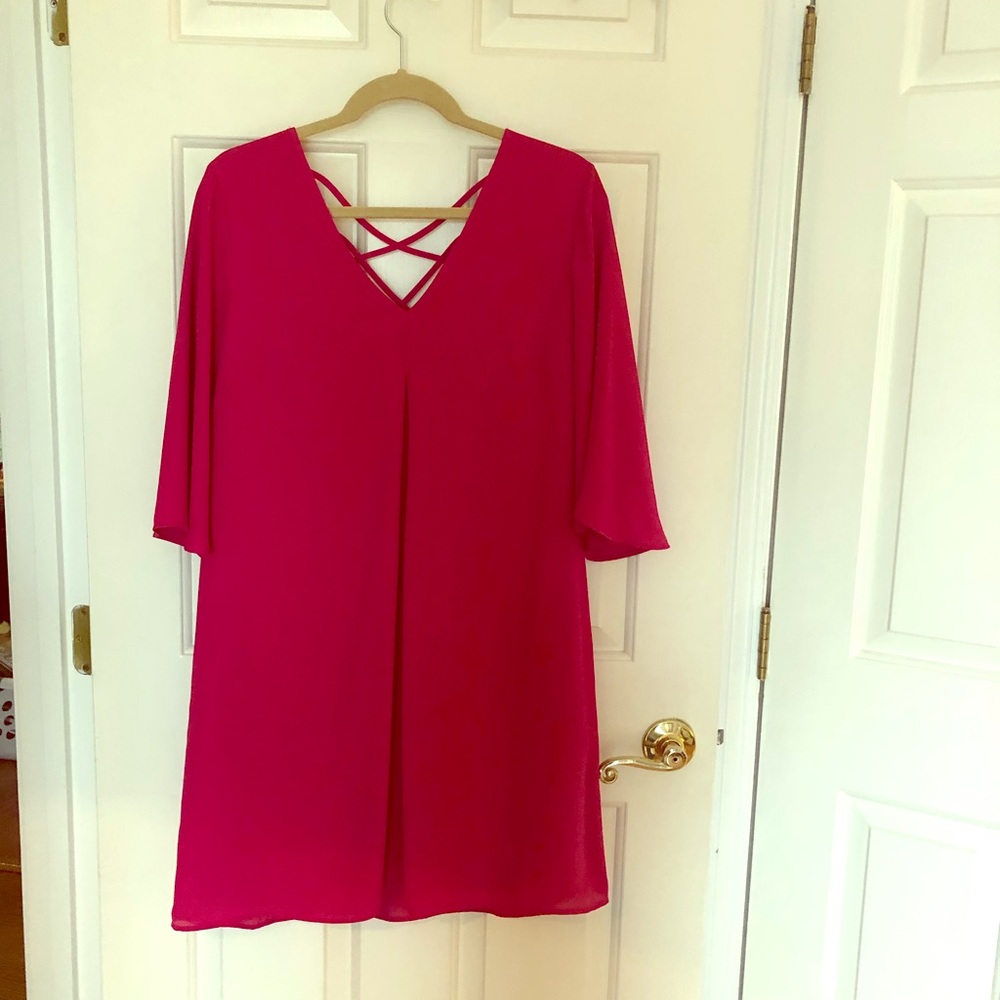 Pink dress with criss cross straps on the back. L